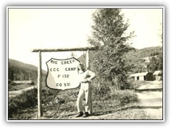 Big Red Lokant (W.Va. ) holding up the sign
