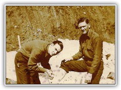 Cutting up a little wood for the barracks stove. Not supposed to cut your leg.