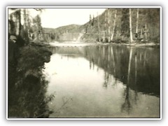 View of the river showing teh water pipeline bridge in the background, taken 1938.